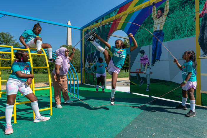 Children activating the installation <em>America's Playground: DC</em> by artist Derrick Adams in Constitution Gardens on the National Mall.