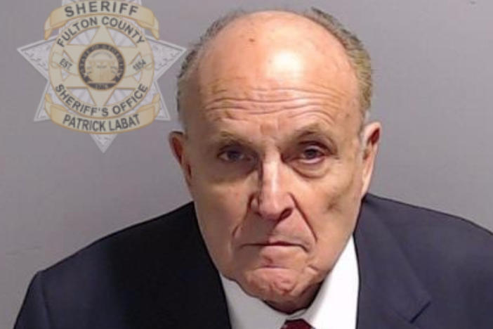 In this handout provided by the Fulton County Sheriff's Office, Rudy Giuliani, former personal lawyer for former President Donald Trump, poses for his booking photo on Aug. 23 in Atlanta.