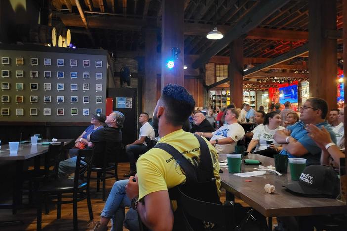Wisconsin voters watch the first presidential debate at a brewpub in Milwaukee, Wisconsin on Wednesday evening.