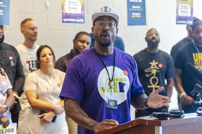 Antonio Williams speaks during a "Restore the Vote" rally in St. Paul, Minn. Williams was formerly incarcerated and has led a canvas effort to reach other people who were incarcerated to register them to vote.