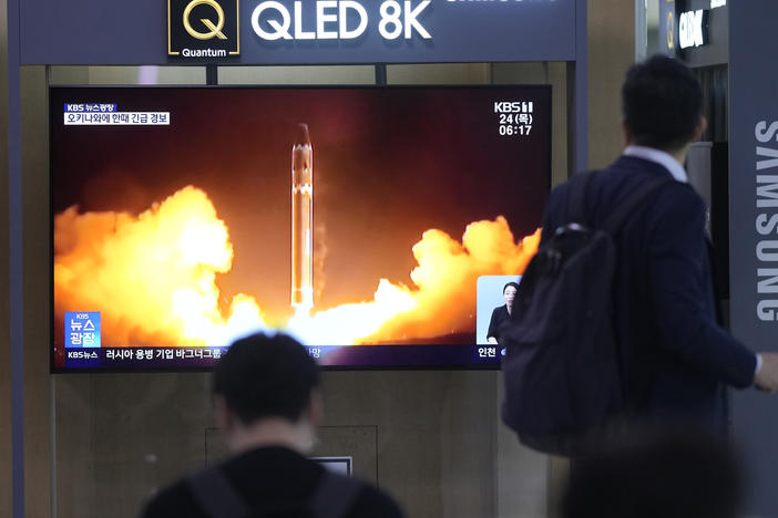 A TV screen shows a report of North Korea's rocket launch with file image during a news program at the Seoul Railway Station in Seoul, South Korea, Thursday, Aug. 24, 2023.
