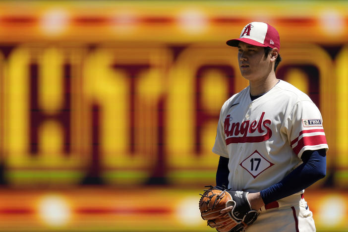 Los Angeles Angels starting pitcher Shohei Ohtani gets set to pitch during the first inning in the first baseball game of a doubleheader against the Cincinnati Reds on Wednesday, in Anaheim, Calif., before an MRI exam revealed his elbow tendon tear.