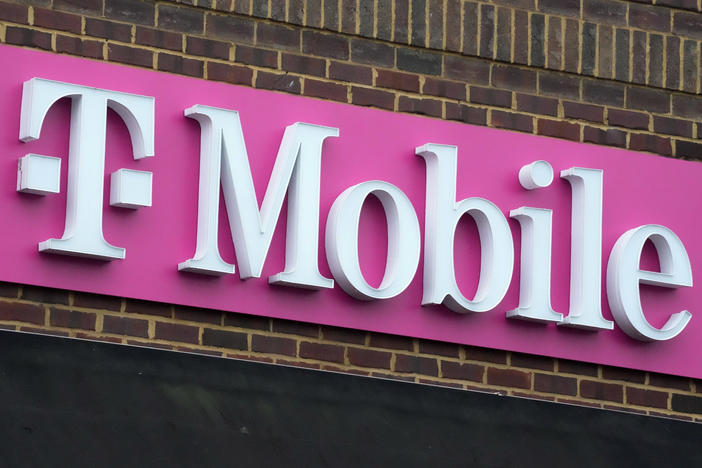 The sign for a T-Mobile store is seen, Jan. 30, 2023, in Pittsburgh. T-Mobile plans to cut 5,000 jobs, or about 7% of its workforce, the U.S. wireless carrier announced Thursday, Aug. 24.