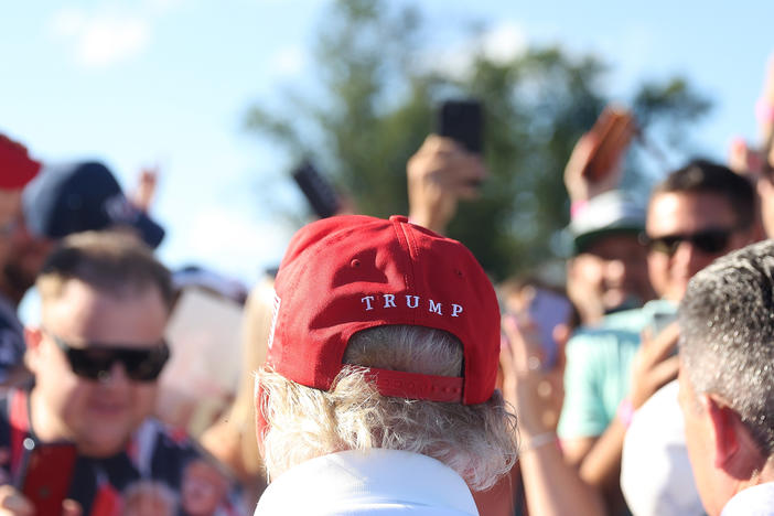 Former President Donald Trump signs autographs at Trump National Golf Club on Aug. 13 in Bedminster, N.J.