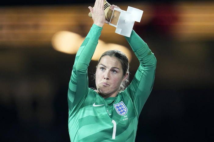 England's goalkeeper Mary Earps applauds after receiving the Golden Glove award for the tournament's best goalkeeper, at the end of the Women's World Cup soccer final between Spain and England in Sydney, Australia, Sunday, Aug. 20, 2023.