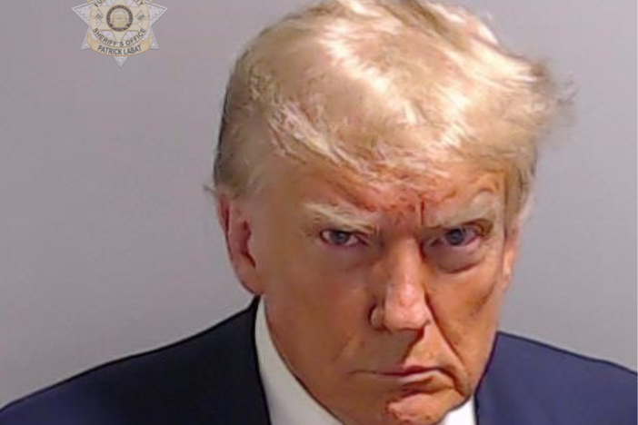 Former President Donald Trump's booking photo was released after he was booked in Atlanta.