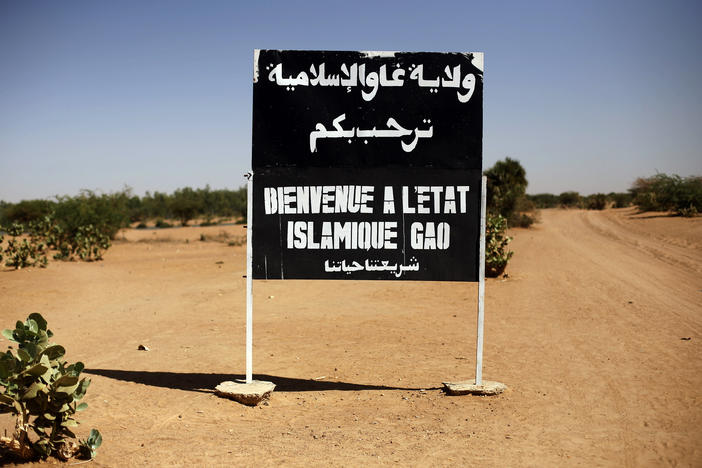 A sign on the northern road exiting in Gao, Northern Mali, reads "welcome to the Islamic state of Gao" on Jan. 30, 2013. Islamic State extremists have almost doubled the territory they control in Mali in less a year.