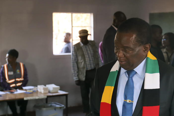 Zimbabwean President Emmerson Mnangagwa attends a polling station to cast his vote, in Kwekwe, Zimbabwe, Wednesday, Aug. 23, 2023.
