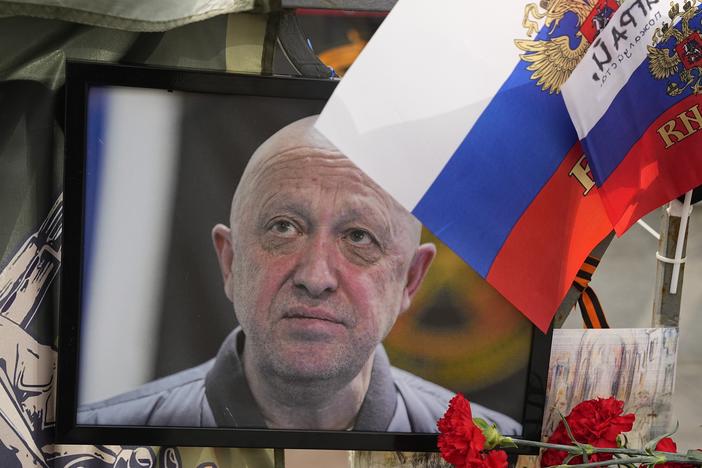 A portrait of the owner of private military company Wagner Group Yevgeny Prigozhin lays at an informal street memorial near the Kremlin in Moscow, Russia, Saturday, Aug. 26, 2023.
