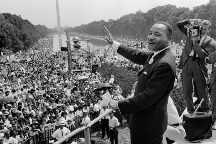 Martin Luther King Jr. waves to the crowd during the "March on Washington" in 1963.