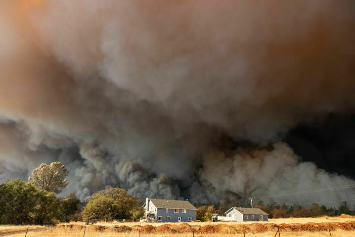 Towering smoke plumes overshadowed California's town of Paradise as the Camp Fire raced through in 2018. More than 18,000 acres burned in a matter of hours.