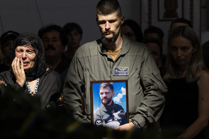 Relatives and soldiers mourn the death of fighter pilot Andrii "Juice" Pilshchykov, 30, during his funeral on Tuesday in Kyiv, Ukraine.