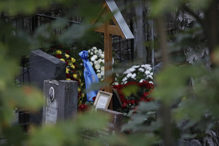 Flowers left on the grave of Yevgeny Prigozhin who died in a plane crash are seen during the funeral ceremony at a cemetery in St. Petersburg, Russia, on Tuesday.