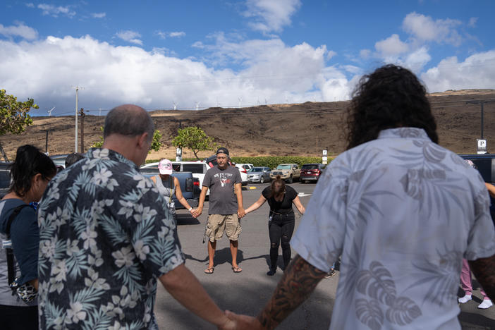 A group of volunteers with Maui Medic Healers Hui gather before heading out to help people affected by the fires in Lahaina.