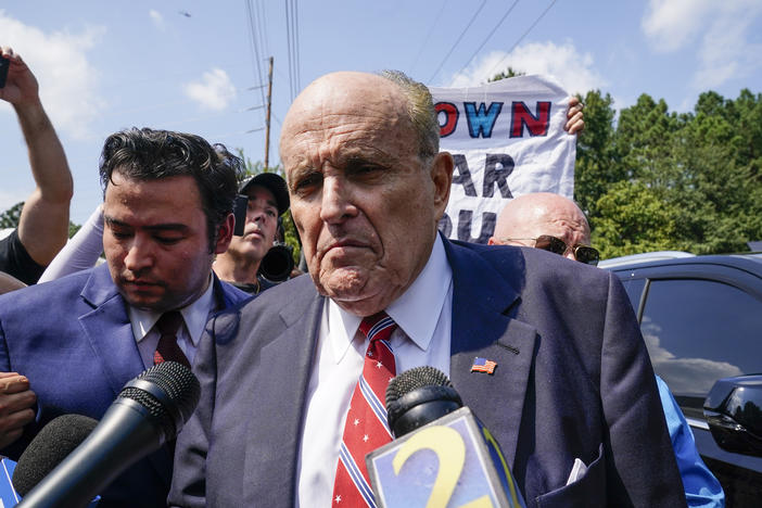 Rudy Giuliani speaks outside the Fulton County jail in Atlanta on Aug. 23, before he surrendered on 13 felony charges related to efforts to try to overturn the 2020 election.