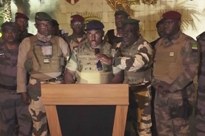 This video grab shoes the spokesperson for the mutinous soldiers speaking on state television as they announce that they had seized power in Libreville, Wednesday Aug. 30, 2023.