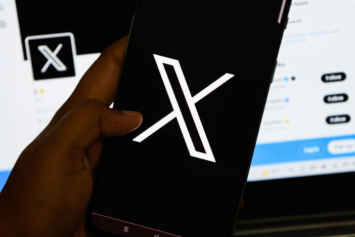 In this photo illustration, the new logo for the social media platform formerly known as Twitter, now X, is seen displayed on a smartphone.
