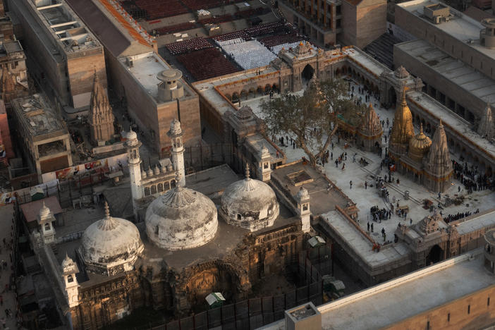 An aerial view shows Gyanvapi mosque (left) and Kashi Vishwanath temple on the banks of the Ganges River in Varanasi, India.