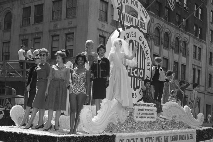 Members of the International Ladies' Garment Workers' Union are seen on a Labor Day parade float, Sept. 4, 1961. While many may associate the holiday with major retail sales and end-of summer barbecues, Labor Day's roots are in worker-driven organizing.