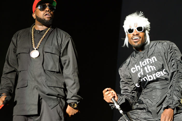 Big Boi (L) and Andre 3000 of Outkast perform onstage during day 3 of the Firefly Music Festival on June 21, 2014 in Dover, Delaware.