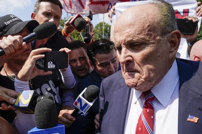 Rudy Giuliani speaks outside the Fulton County jail Aug. 23, in Atlanta. On Friday, he pleaded not guilty to charges that accuse him of trying to illegally overturn the results of the 2020 election in the state.