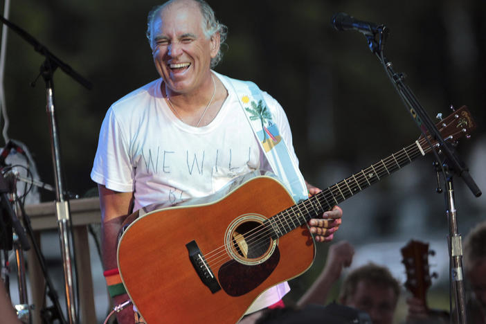Jimmy Buffett performs in Gulf Shores, Ala., on June 30, 2010. The "Margaritaville" singer-songwriter has died at age 76.