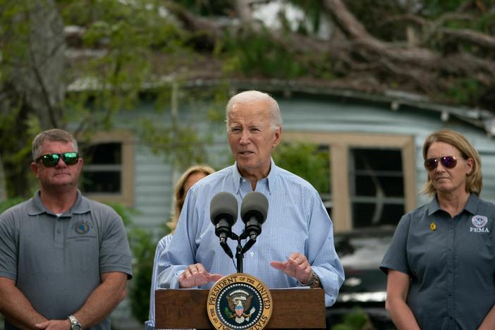 President Biden speaks in front of a home destroyed by fallen trees and debris during a tour of communities impacted by Hurricane Idalia, in Live Oak, Fla., on Saturday.