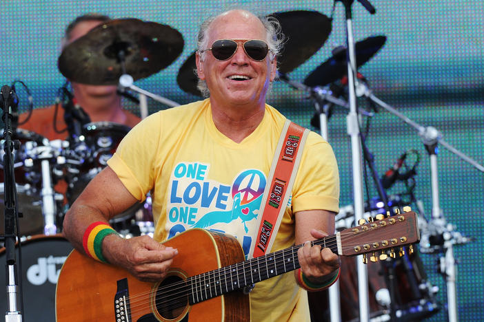 Musician Jimmy Buffett performs onstage at Jimmy Buffett & Friends: Live from the Gulf Coast, a concert presented by CMT at on the beach on July 11, 2010 in Gulf Shores, Alabama.
