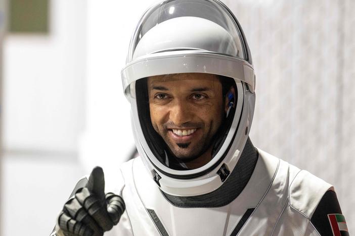 Mission Specialist Sultan Alneyadi of the United Arab Emirates, member of the SpaceX Dragon Crew-6 mission, gestures during the crew walkout from the Neil A. Armstrong Operations and Checkout Building for Launch Complex 39A ahead of their liftoff at NASA's Kennedy Space Center in Cape Canaveral, Fla., on March 1.