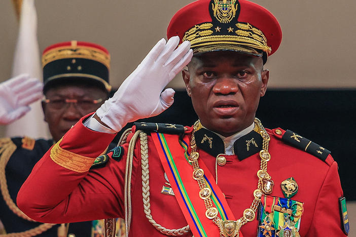 Gen. Brice Oligui Nguema salutes as he is inaugurated as Gabon's interim president, in Libreville, Monday.