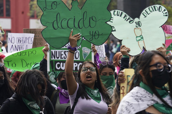 A woman holds up a sign with a message that reads in Spanish; "I will decide" as she joins a march demanding legal, free and safe abortions for all women, marking International Safe Abortion Day, in Mexico City, Sept. 28, 2022. Mexico's Supreme Court on Wednesday, Sept. 6, 2023, has decriminalized abortion nationwide.
