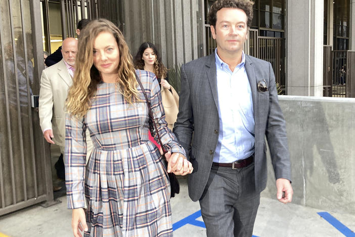 Actor Danny Masterson leaves Los Angeles superior Court with his wife Bijou Phillips after a judge declared a mistrial in his rape case in 2022.