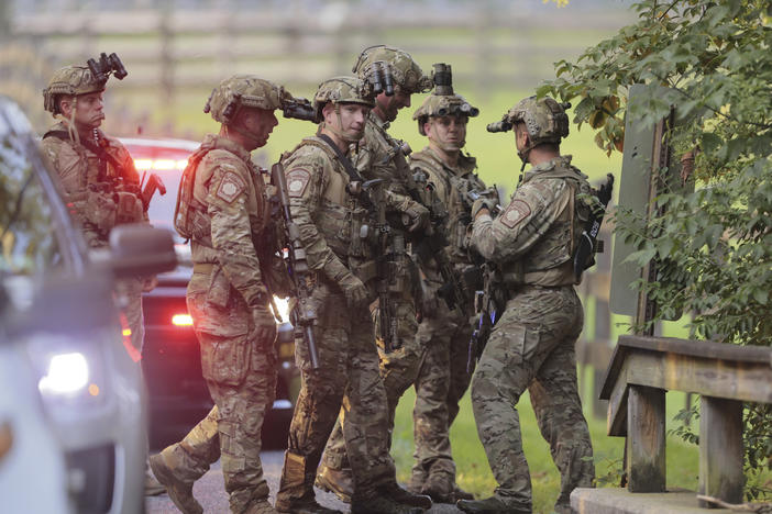 Pennsylvania State police search the woods and a creek in Pennsbury Township, Pa., on Tuesday, Sept. 5, 2023. Murderer Danelo Cavalcante was able to escape a prison yard in suburban Pennsylvania last week by climbing up a wall and over razor wire, officials said at a news conference Wednesday.