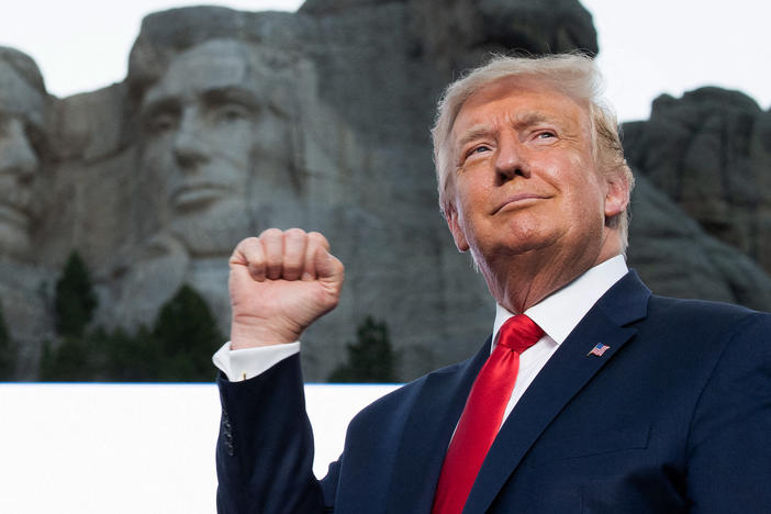 Former President Donald Trump pumps his fist at Mount Rushmore National Memorial in Keystone, South Dakota, July 3, 2020.