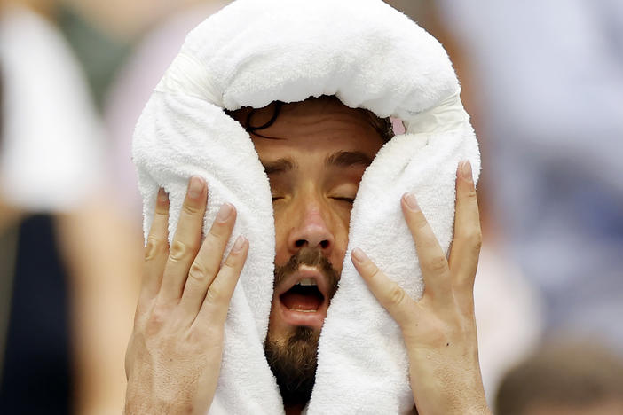 Daniil Medvedev cools down against Andrey Rublev of Russia during their men's singles quarterfinal match.