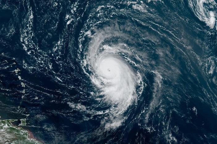 Hurricane Lee formed a well-defined eye wall on Thursday. The storm is seen here in a satellite image from around noon ET Thursday, showing the Leeward Islands and Puerto Rico to the west.