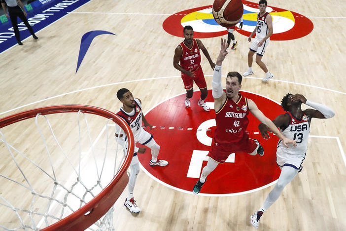 Germany's Andreas Obst drives to the basket against Team USA in the FIBA Basketball World Cup semifinals Friday. Germany upset the U.S. 113-111, and will take on Serbia this Sunday in its first-ever championship game.