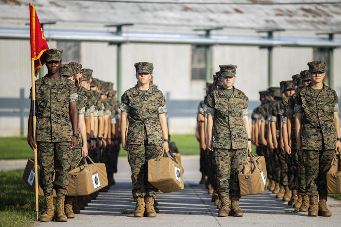 Marine recruits wait for their drill instructor as they cross the base at Marine Corps Recruit Depot, Parris Island on August 22 in Beaufort County, S.C.