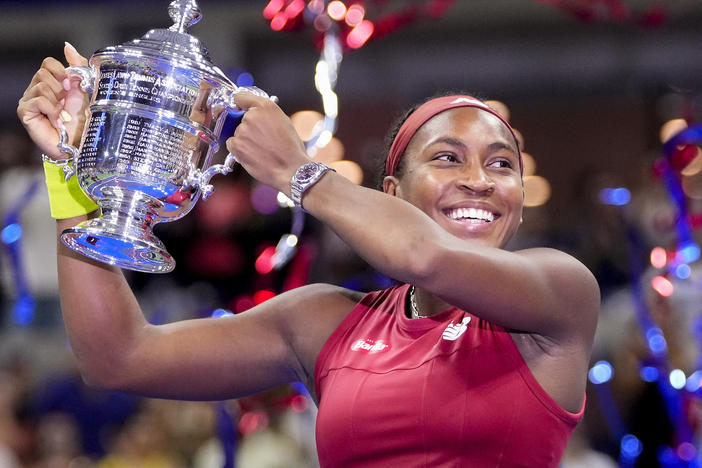 Coco Gauff holds up the championship trophy after defeating Aryna Sabalenka in the women's singles final of the U.S. Open tennis championships on Saturday in New York.