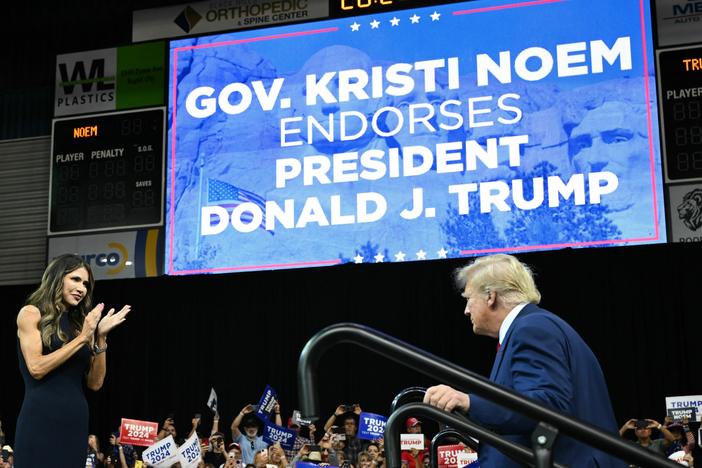 South Dakota Governor, Kristi Noem welcomes 2024 Republican Presidential hopeful Donald Trump to the stage during a rally in Rapid City, South Dakota.