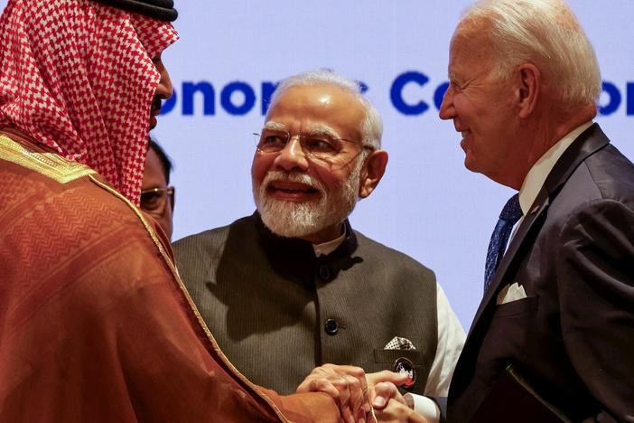 President Biden shakes hands with Saudi Arabia's Crown Prince Mohammed bin Salman and India's Prime Minister Narendra Modi after announcing a new corridor to link India to the Middle East and Europe.