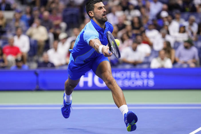 Novak Djokovic, of Serbia, returns a shot to Daniil Medvedev, of Russia, during the men's singles final of the U.S. Open tennis championships, on Sunday in New York.