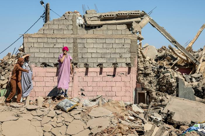 Villagers inspect the rubble of collapsed houses in Tafeghaghte, southwest of Marrakesh, on Sept. 10.
