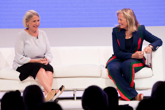 Anita Dunn (left) speaks onstage with Hilary Rosen (right) at an event titled "Women Rule" in June 2018. That summer, Dunn and her communications firm began providing crisis communications for the then-Speaker of the Illinois House of Representatives regarding allegations of sexual harassment and retaliation.