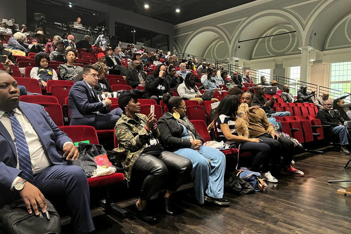 People listen to the California reparations task force in Oakland, Calif., at one of its final meetings in May.
