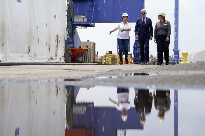 President Biden tours a shipyard in Philadelphia with two union members on July 20 before giving remarks about unions and clean energy jobs.