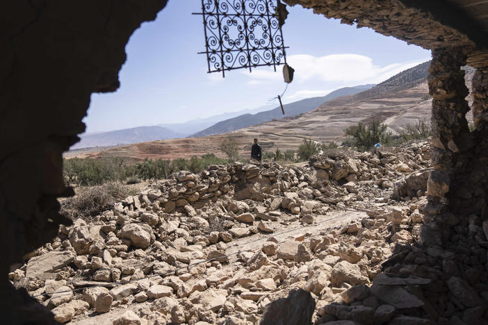 A man walks past rubble caused by the earthquake in the village of Tafeghaghte, near Marrakech, Morocco, on Monday.