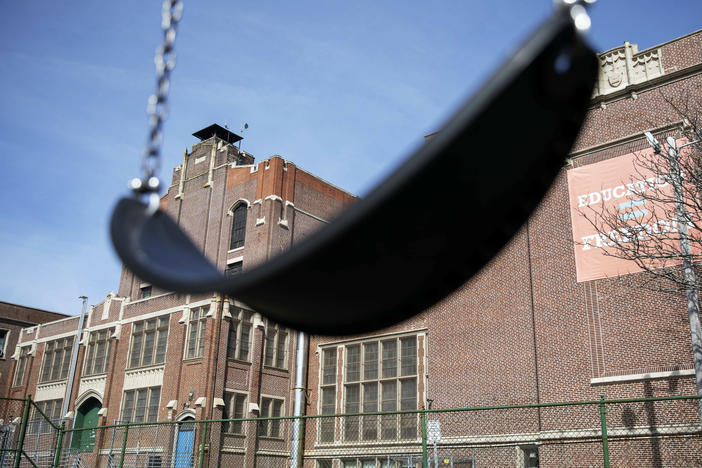 A swing sits empty on a playground outside in Providence, R.I. Experts say the end of the expanded child tax credit was a key factor in the big rise in child poverty.