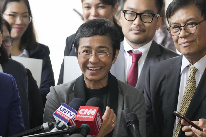 Maria Ressa, 2021 Nobel Peace Prize winner and Rappler CEO, gestures as she talks to reporters after being acquitted by the Pasig Regional Trial Court over a tax evasion case in Pasig city, Philippines on Tuesday, Sept. 12, 2023.