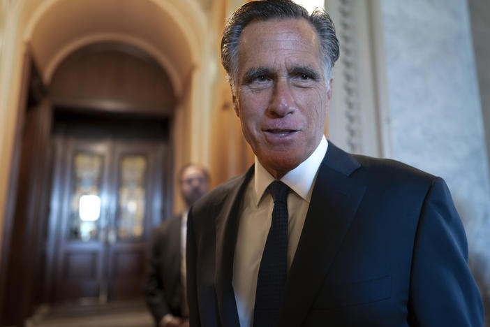 Sen. Mitt Romney, R-Utah, and other senators arrive at the chamber for votes at the U.S. Capitol on September 6.